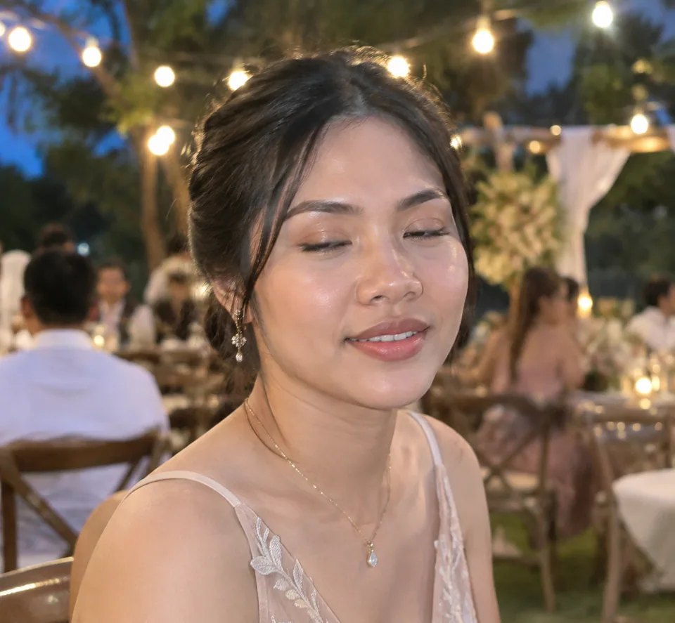 Original photo: woman caught mid-blink at an outdoor wedding party