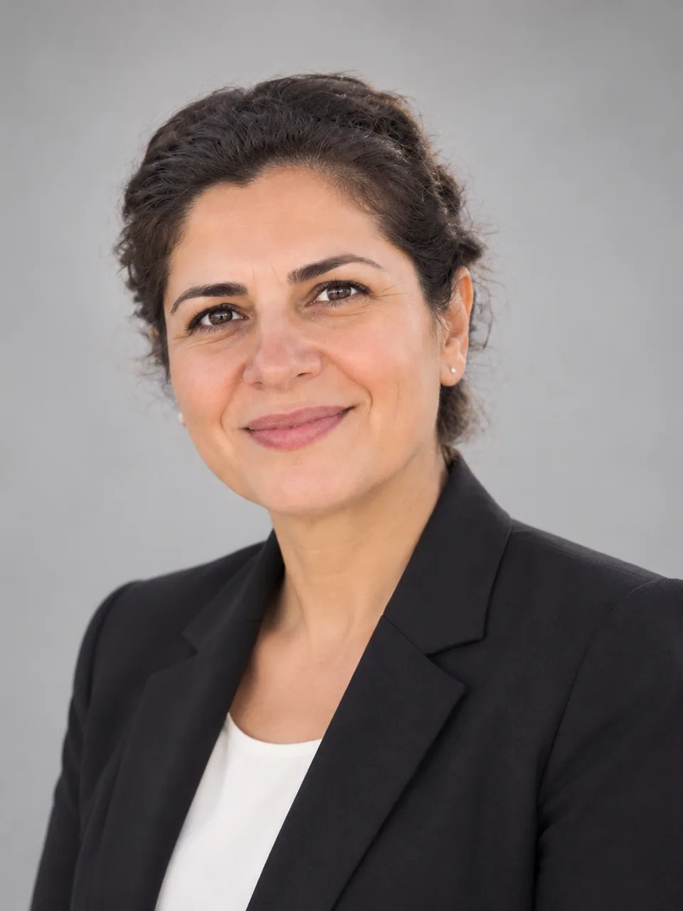AI result: corporate headshot with a grey backdrop and soft even light