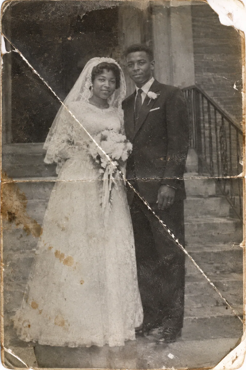 Original: faded 1950s wedding photo with a crease, scratches and a torn corner
