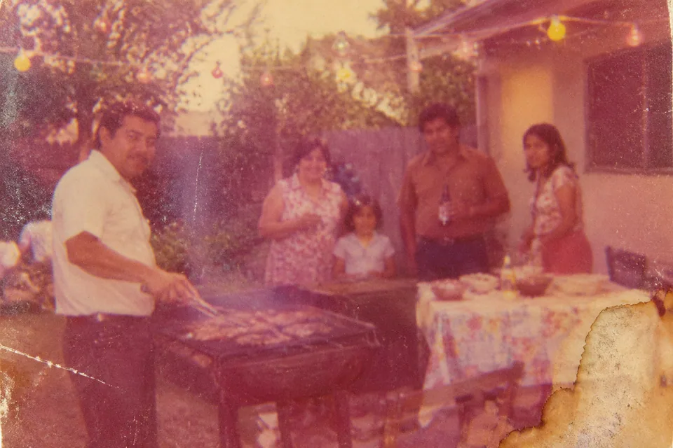 Original: color-shifted 1970s snapshot of a family backyard barbecue