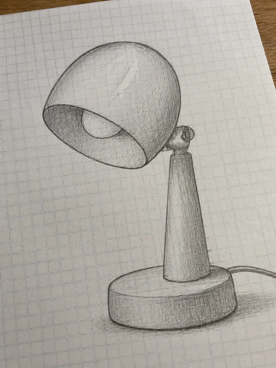 Original: pencil sketch of a desk lamp concept on graph paper