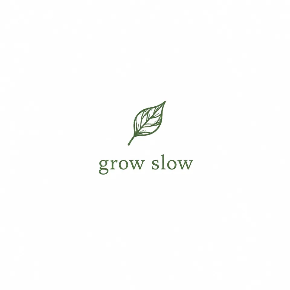 Original design: small green leaf with the words 'grow slow'