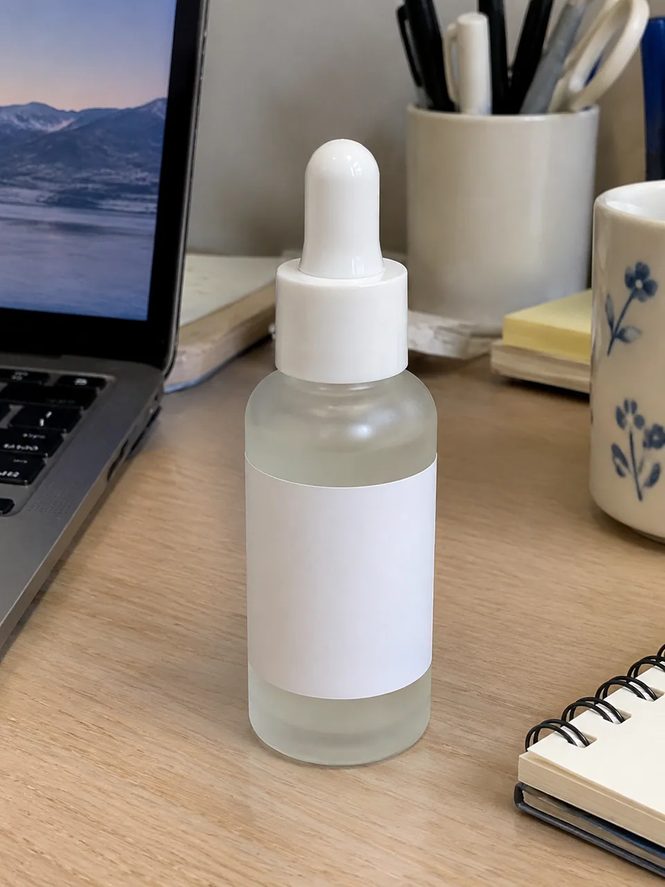 Original photo: serum bottle on a cluttered desk