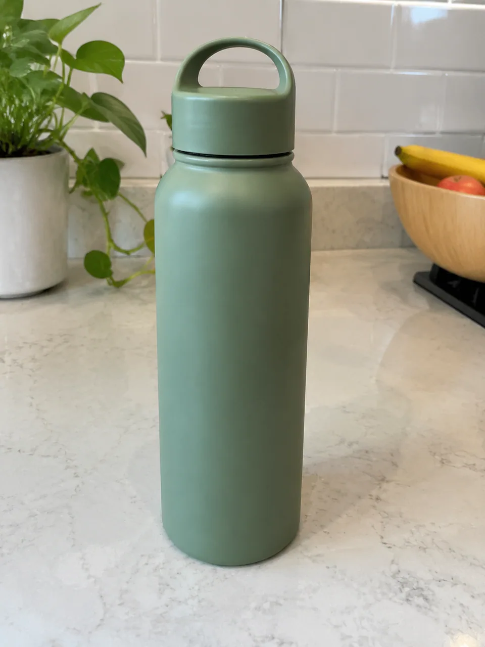 Original photo: green water bottle on a kitchen counter